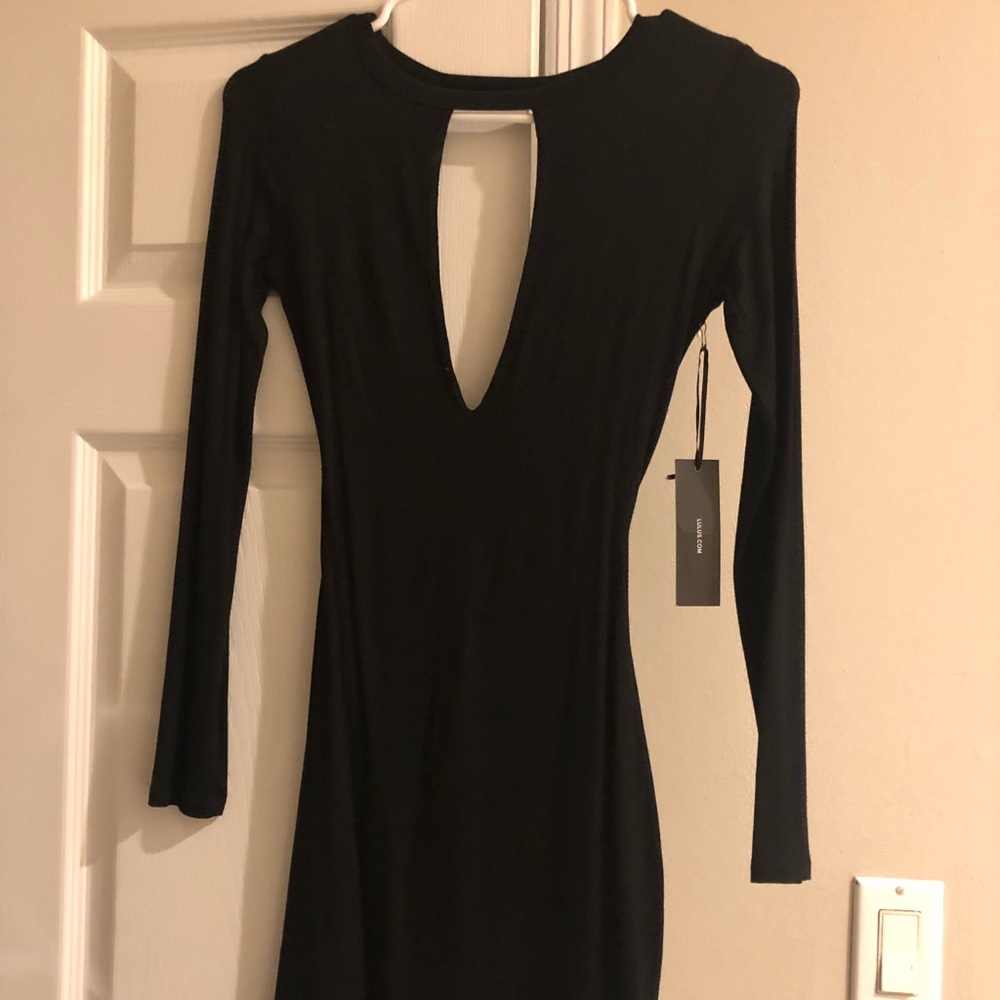 Black dress. Open back.